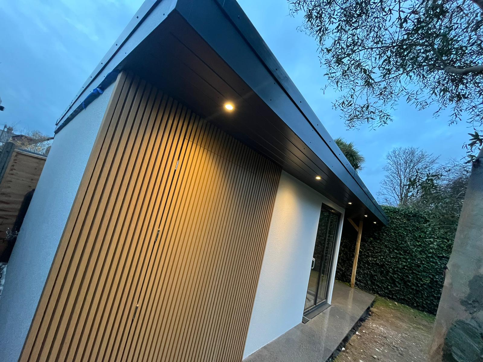 Vertical timber cladding and recessed exterior lighting